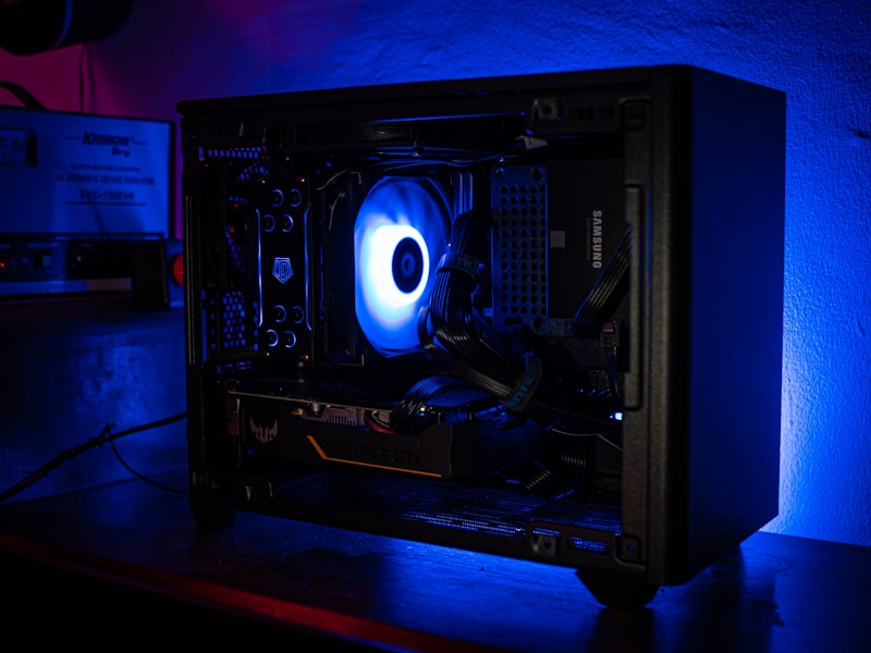 Rows of gaming PCs under neon lighting
